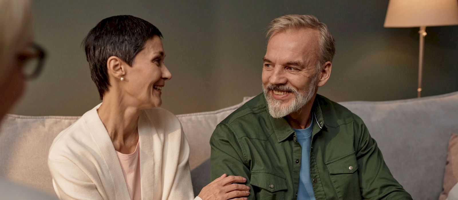 Couple smiling during a counselling session with an experienced male couples counsellor in Duncan BC, relationship counselling and marriage therapy services.